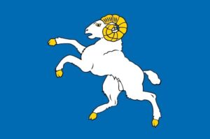 Bannière de St Corentin : fond bleu avec un bélier blanc à cornes dorées
